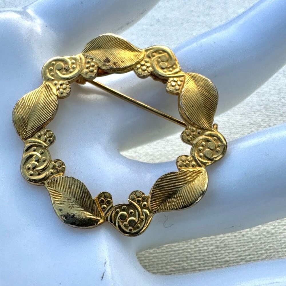 Gold tone leaf  wreath brooch